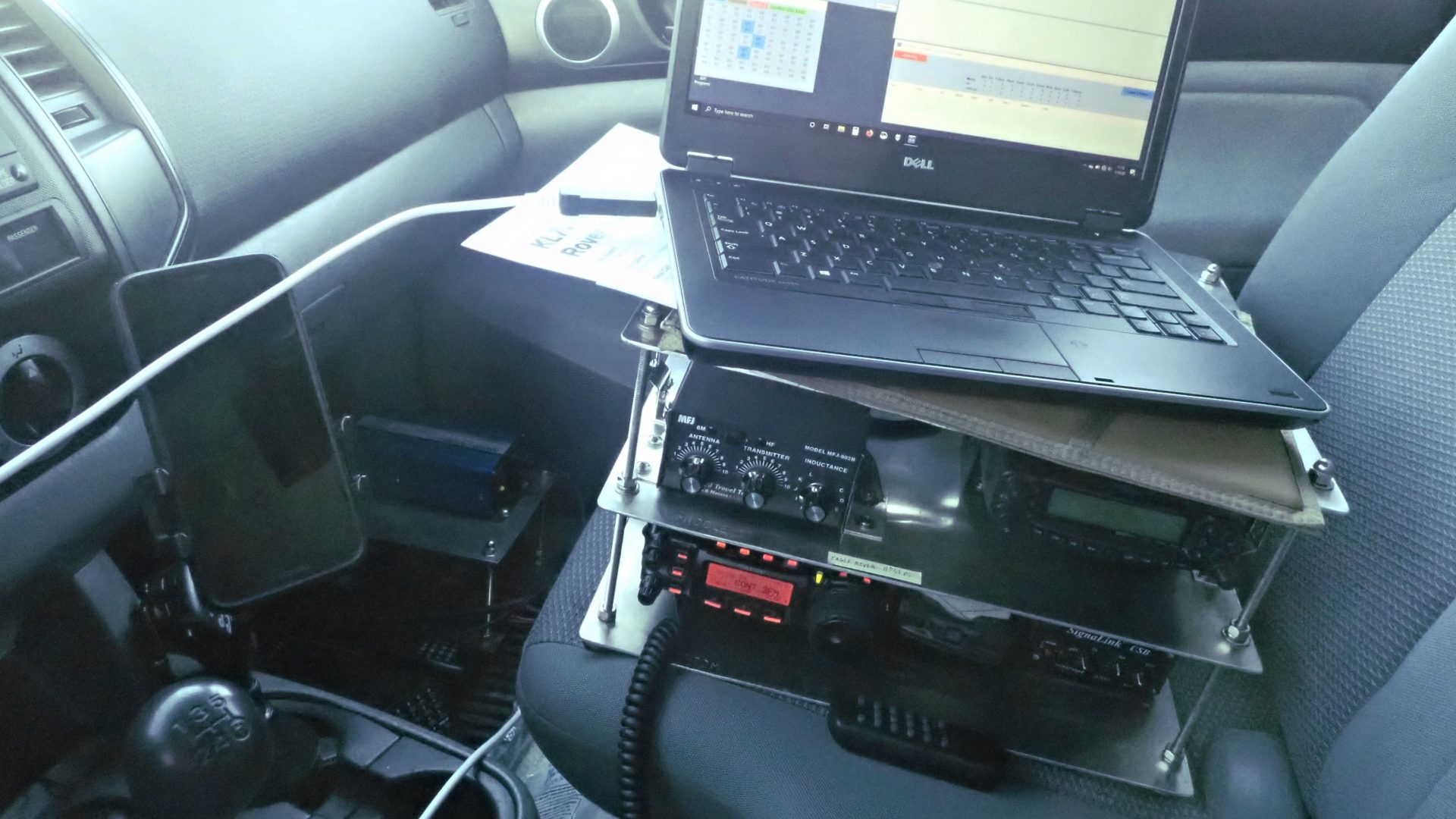 Ham radio go-kit on the seat of a pickup truck