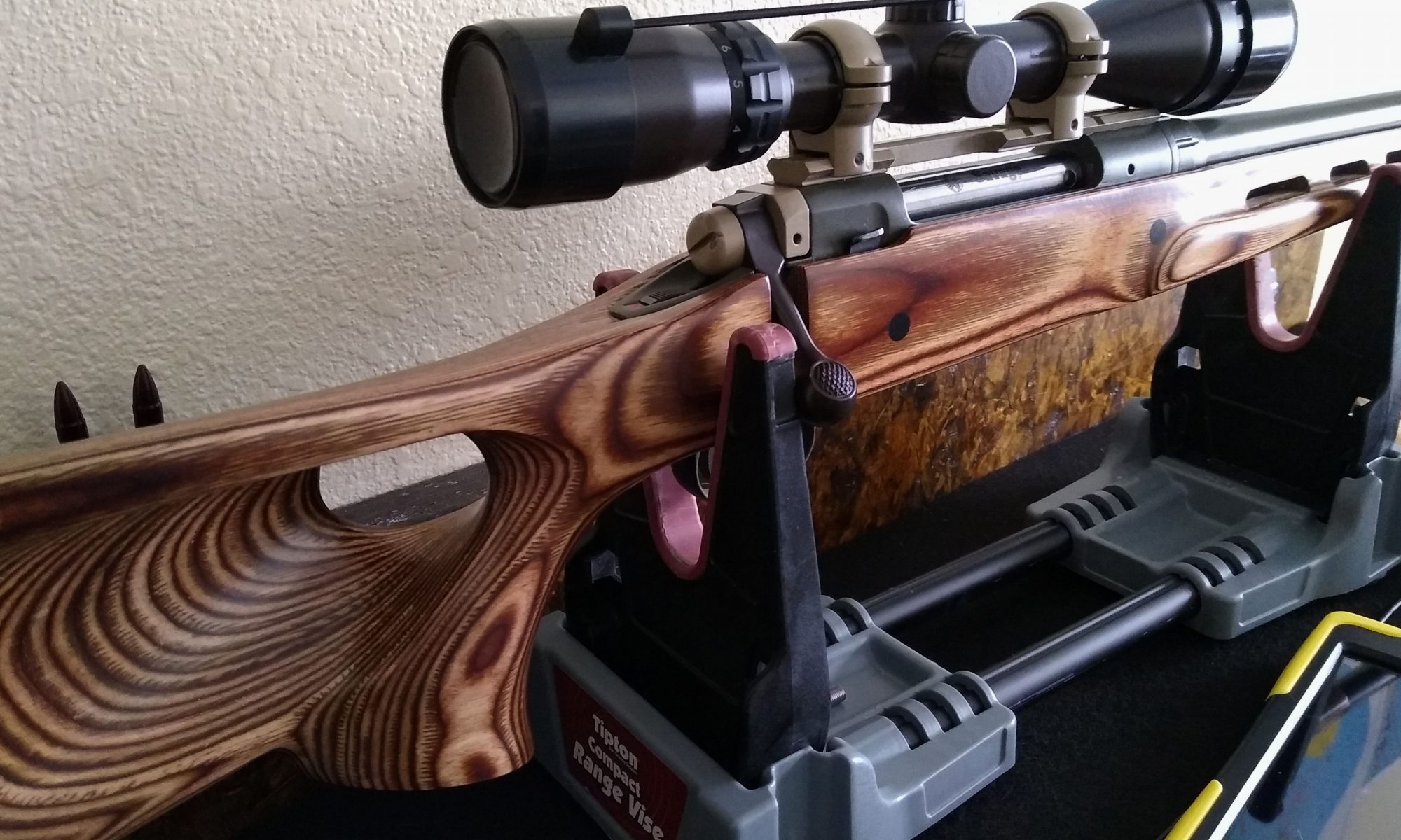 Savage rifle with painted metalwork and scope
