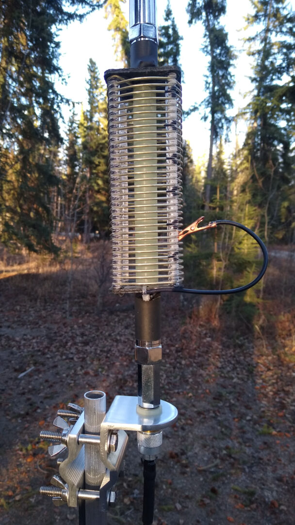 MFJ loaded vertical antenna with manual clip for changing the antenna's inductive loading.